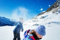 Kids play snowball active winter game in mountains Royalty Free Stock Photo