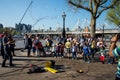 Kids play with soap bubbles during performance of one of the street artists near Jubilee gardens and London Eye Observation Wheel Royalty Free Stock Photo