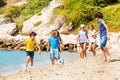 Kids play soccer ball on the sea beach Royalty Free Stock Photo