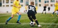 Kids Play Soccer Game. Children Outdoor Football Tournament Match on Grass Field