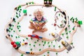 Child with toy train. Kids wooden railway. Royalty Free Stock Photo