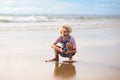 Kids play on tropical beach. Sand and water toy Royalty Free Stock Photo