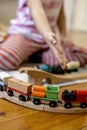 Kids play with wooden railway. Child with toy train. Cute kid playing cars and engine. Educational toys young children Royalty Free Stock Photo