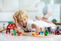 Kids play wooden railway. Child with toy train Royalty Free Stock Photo