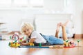 Kids play wooden railway. Child with toy train Royalty Free Stock Photo