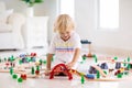 Kids play wooden railway. Child with toy train Royalty Free Stock Photo