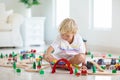 Kids play wooden railway. Child with toy train Royalty Free Stock Photo