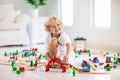 Kids play wooden railway. Child with toy train Royalty Free Stock Photo