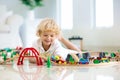 Kids play wooden railway. Child with toy train Royalty Free Stock Photo