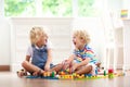 Kids play wooden railway. Child with toy train Royalty Free Stock Photo