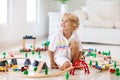 Kids play wooden railway. Child with toy train