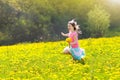 Kids play. Child in dandelion field. Summer flower Royalty Free Stock Photo