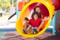 Kids on playground. Children on school yard slide Royalty Free Stock Photo