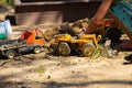 Kids on Playground playing in Sandbox with  digger Royalty Free Stock Photo