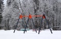 Kids playground on a snowy winter day. Royalty Free Stock Photo