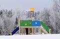 Kids playground on a snowy winter day. Royalty Free Stock Photo