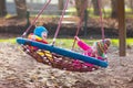 Kids on playground swing