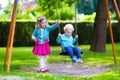 Kids on playground swing