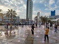 Kids playing around the Public Fountain at Mubarakiya Old Souq Royalty Free Stock Photo
