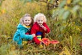 Kids playing in autumn forest