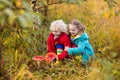 Kids playing in autumn forest