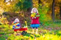 Kids playing in autumn park Royalty Free Stock Photo