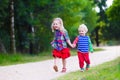 Kids playing in autumn park Royalty Free Stock Photo