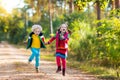 Kids playing in autumn park Royalty Free Stock Photo