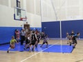 Kids playing basketball indoor