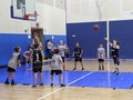 Kids playing basketball indoor