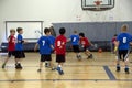 Kids playing basketball match