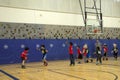 Kids playing basketball match