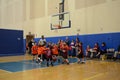 Kids playing basketball match