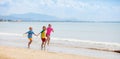 Kids playing on beach. Children play at sea