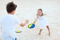 Kids playing beach tennis Royalty Free Stock Photo