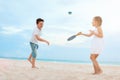 Kids playing beach tennis Royalty Free Stock Photo