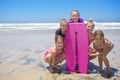 Kids playing at the beach together while on vacation Royalty Free Stock Photo