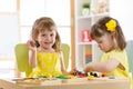 Kids playing block toys in playroom at nursery Royalty Free Stock Photo