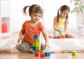 Kids playing block toys in playroom at nursery Royalty Free Stock Photo