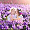 Kids playing in blooming garden with hyacinth flowers Royalty Free Stock Photo