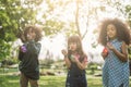 Kids playing Blowing Bubbles Together at the Field. Royalty Free Stock Photo