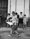 Kids playing bullfighting game in street Royalty Free Stock Photo