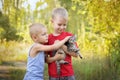 Kids playing with cat