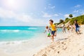 Kids playing catch-up on sandy beach Royalty Free Stock Photo