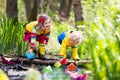 Kids playing with colorful paper boats in a park Royalty Free Stock Photo