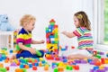 Kids playing with colorful toy blocks Royalty Free Stock Photo