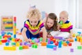 Kids playing with colorful toy blocks Royalty Free Stock Photo