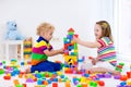 Kids playing with colorful toy blocks Royalty Free Stock Photo