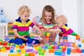 Kids playing with colorful toy blocks Royalty Free Stock Photo