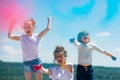 Kids playing with colours, celebrating holi. Excited children facial expression.